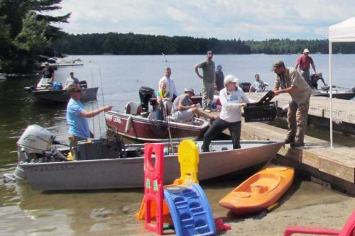 participants in the LOLTA's Bass tourney weigh in at Kirk Kove Cottages on Big Gull Lake in North Frontenac